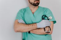 Kaboompics - Male Doctor Resting a Stethoscope across Crossed Arms, Horizontal Healthcare Profile