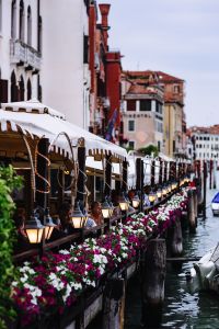 Kaboompics - Canal-Side Cafe Awnings, Flower Boxes and Lanterns in Venice