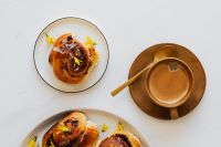 Kaboompics - Overhead Coffee and Cinnamon Rolls on White Table