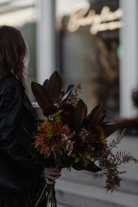 Kaboompics - Autumn Bouquet Against a Blurred City Shopfront