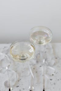 Kaboompics - Close-Up of Two Champagne Glasses on White Marble