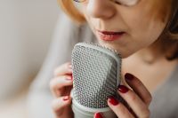 Kaboompics - Woman Crinkling Bubble Wrap beside a Studio Microphone for ASMR Sounds