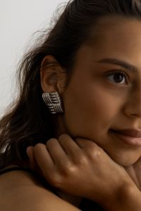 Kaboompics - Close-Up Portrait of Woman Wearing Silver Statement Earring