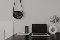 Kaboompics - Dark Home Office Desk with Laptop, Black Leather Bag and Candle Still Life