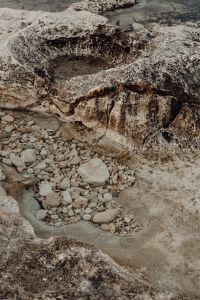 Kaboompics - Limestone Rock Pools and Pebbles on a Weathered Shore