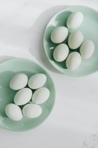 Kaboompics - Easter flat lay with green eggs on a white marble