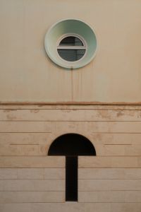 Kaboompics - Minimalist Building Facade with Round Window in Malaga