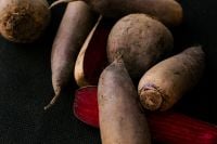 Kaboompics - Dark Root Vegetables with Red Beets on a Black Background