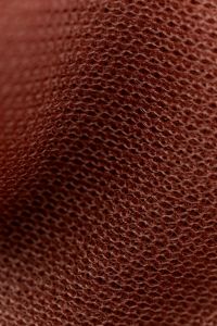 Kaboompics - Dark rust open mesh sheer fabric draped close-up texture