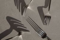 Kaboompics - Steel Forks with Long Shadows on a Minimal Textured Background