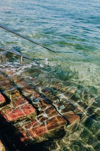 Kaboompics - Sunlit Stone Steps Beneath Clear Adriatic Water