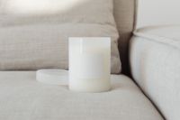 Kaboompics - Close-Up White Glass Candle Mockup with Blank Label