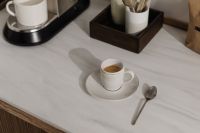 Kaboompics - White Espresso Cup on Countertop Beside Coffee Machine