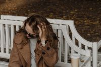 Kaboompics - Woman Taking a Phone Call on an Autumn Park Bench
