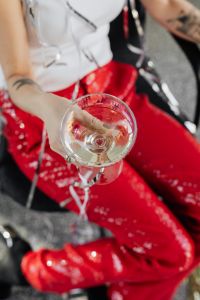 Kaboompics - Seated New Year Portrait with Champagne and Silver Streamers