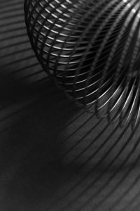 Kaboompics - Silver Coil Texture with Long Curved Shadow