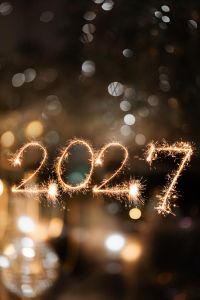 Kaboompics - 2027 New Year's Eve Sparklers With Golden Bokeh Lights