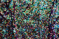 Kaboompics - Green, Teal and Gold Sequin Texture on Dark Fabric, Colorful Background