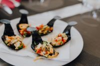 Kaboompics - Overhead Seafood Canapes in Black Shell-Shaped Dishes