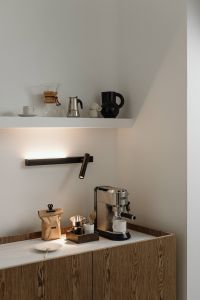 Kaboompics - Minimal Coffee Bar with Espresso Machine and Floating Shelf