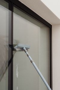 Kaboompics - Close-Up of Squeegee Cleaning a Glass Window