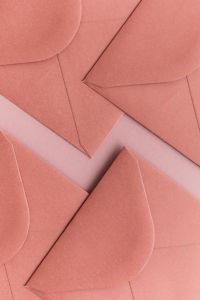 Kaboompics - Pastel Envelopes Flat Lay On Pink Background