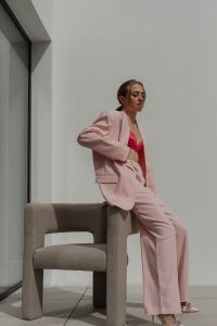 Kaboompics - Woman Sitting on a Chair in a Pale Pink Blazer