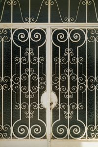 Kaboompics - Ornate White Iron Gate Architectural Detail