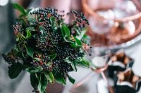 Kaboompics - Green Berry Arrangement with Blurred Christmas Table Background
