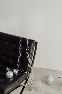 Kaboompics - Black Leather Chair Beneath Blank Wall with Disco Balls at the Base
