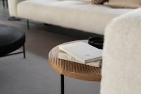 Kaboompics - Oak Coffee Table and Beige Sofa with Books and Black Mug