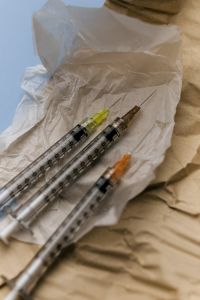 Kaboompics - Two Syringes on Crumpled Tissue Paper