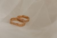 Kaboompics - Gold Wedding Rings on Sheer Veil with Copy Space