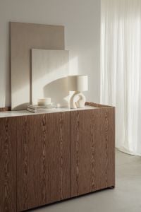 Kaboompics - Cream Ceramic Table Lamp with Textured Wall Art in a Neutral Living Room
