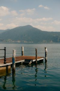 Kaboompics - Wooden Jetty Over Lake Iseo With Mountains in the Distance