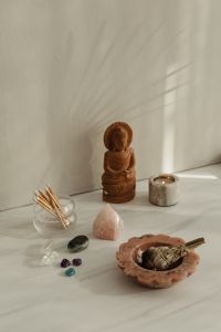 Kaboompics - Wooden Buddha Crystals And Matchsticks In Meditation Setting