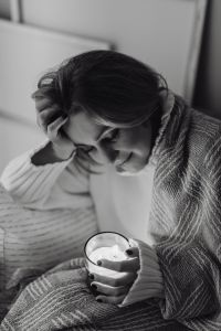 Kaboompics - Black and White Cocooning Portrait: Woman with a Candle