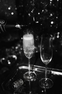 Kaboompics - Pouring Champagne Into A Glass At New Year's Eve Celebration