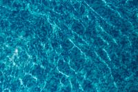 Kaboompics - Deep Blue Pool Water with Sunlit Ripples and Mosaic Tiles, Abstract Summer Texture