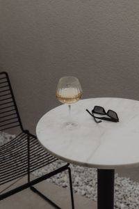 Kaboompics - White Wine Aperitif on Marble Table at Restaurant Patio