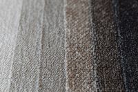 Kaboompics - Layered Neutral Bouclé Upholstery Fabric Swatches