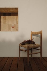 Kaboompics - Red Grapes on Woven Chair with Wine Glass