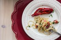 Kaboompics - Overhead Crayfish Pasta Dinner Plate on Red Charger