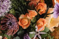Kaboompics - Botanical Bouquet Detail With Orange Roses and Protea-Like Bloom