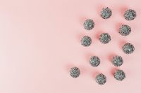 Kaboompics - Silver Christmas Baubles on Pink Background with Copy Space