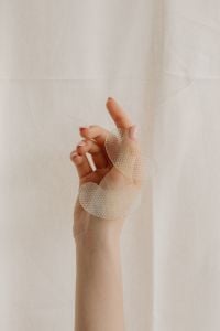 Kaboompics - Hand Holding Hydrogel Eye Patches for a Skincare Routine