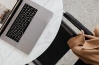 Kaboompics - MacBook Pro 15 laptop and iPhone 11 Pro on a marble table