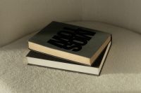 Kaboompics - Minimalist Reading Aesthetic with Hardcover Book on Cream Chair