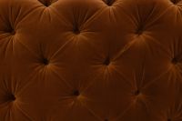 Kaboompics - Repeating Diamond Tuft Pattern on Orange Velvet Sofa Upholstery