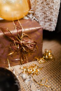 Kaboompics - New Year's Eve party - closeup of gift with ribbon